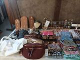 a table full of purses and handbags on a table