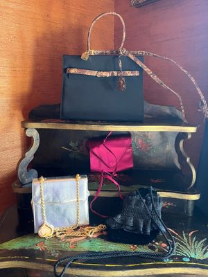a stack of luggage sitting on top of a wooden table