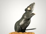statue of a rat on a cracker