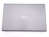 the back of a laptop with a silver cover on a white surface