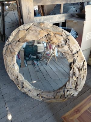 a mirror that is made out of drift wood