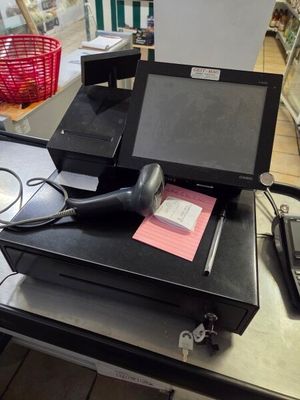 an image of a cash register on a table in a store