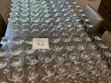 a lot of empty wine glasses sitting on a table