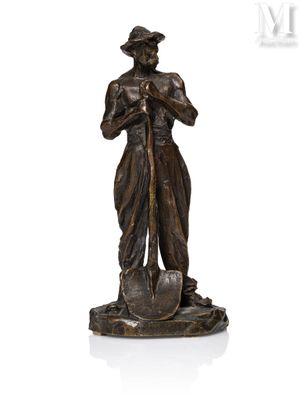 a statue of a man with a shovel in his hand