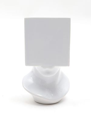 a white plate with a card on top of it