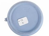 an overhead view of a blue lid with a white tag on it