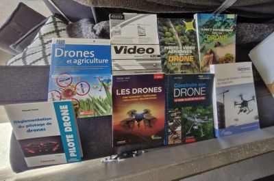 a lot of books that are sitting in the back of a car
