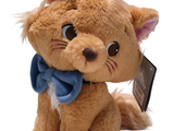 a brown cat with a blue bow on its head