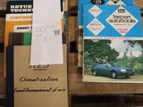 a lot of books on a pallet next to a car