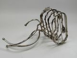 a metal wire holder that has a bunch of wires attached to it