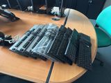 a desk with a bunch of laptops on top of it