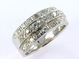 a close up of a diamond ring on a white background