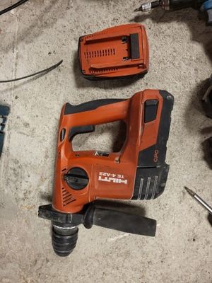 a cordless drill and a cordless hammer on the floor