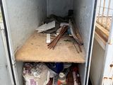 a small storage area in the back of a truck
