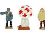 four figurines of people and a dog on a white background
