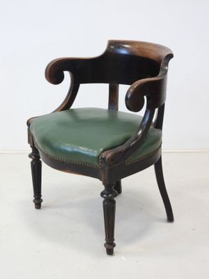 an image of a pair of chairs with green leather upholstered