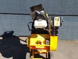 a small machine that is sitting on the side of the road