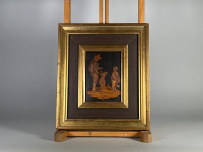 une image représentant un tableau posé sur un chevalet, sur lequel on voit un homme et une femme