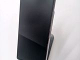 a cell phone that is sitting on top of a stand