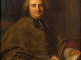 portrait of a man with a book in his lap
