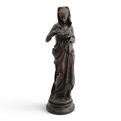 an old statue of a woman holding a baby in her arms