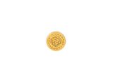 a close up of a gold coin on a white surface
