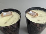 candles are sitting on a table next to each other on a table