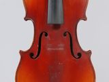 an old violin with a bow hanging from it ' s back