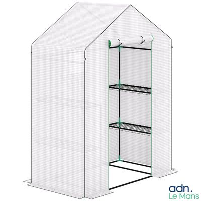 a white greenhouse with shelves and shelves inside of it