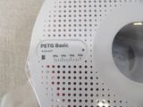 a close up of a white radio on a table