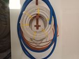 a picture of a room with a bunch of hoses hanging on the wall
