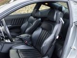 the interior of a car with black leather seats and a steering wheel