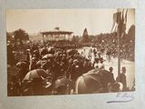 an old photo of a crowd of people with umbrellas