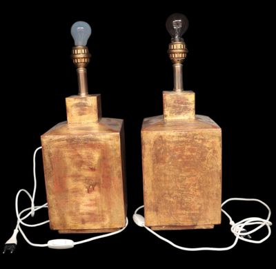 pair of wooden table lamps with lampshads on each of them