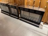 two wine coolers in the middle of a room