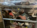 a cart with a lot of stuffed animals in it