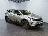 the silver suv is parked in a white room with a black floor