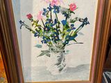 painting of a vase of flowers on a table next to a book