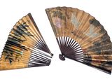 two asian fans on a white background with a white background