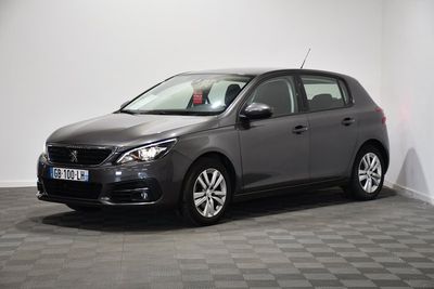 a picture of a grey car parked in a room