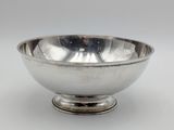 silver plated bowl on pedestal on white background with grey background