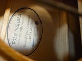 a label on the bottom of a shoe in a wooden box