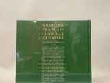 the back cover of a green book with a picture of a castle in the background
