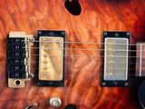 a close up of a guitar that is on a table