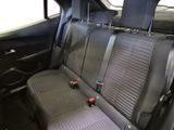 the back seats of a car are black and grey in color