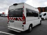 a white van that is parked in a parking lot