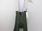 the bib shorts are green and white with a white top