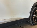 a close up of a white car with black rims