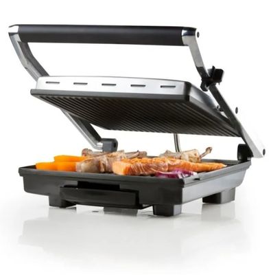 an image of a close up of a grill with food on it