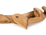 an old wooden plane with a heart shaped handle on a white background